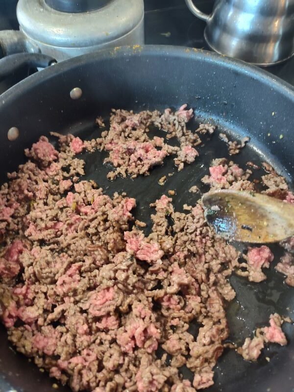 Add more olive oil and add the ground beef 