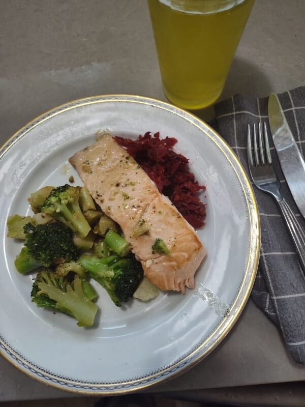 The plated dish with low carb salmon and brocolli