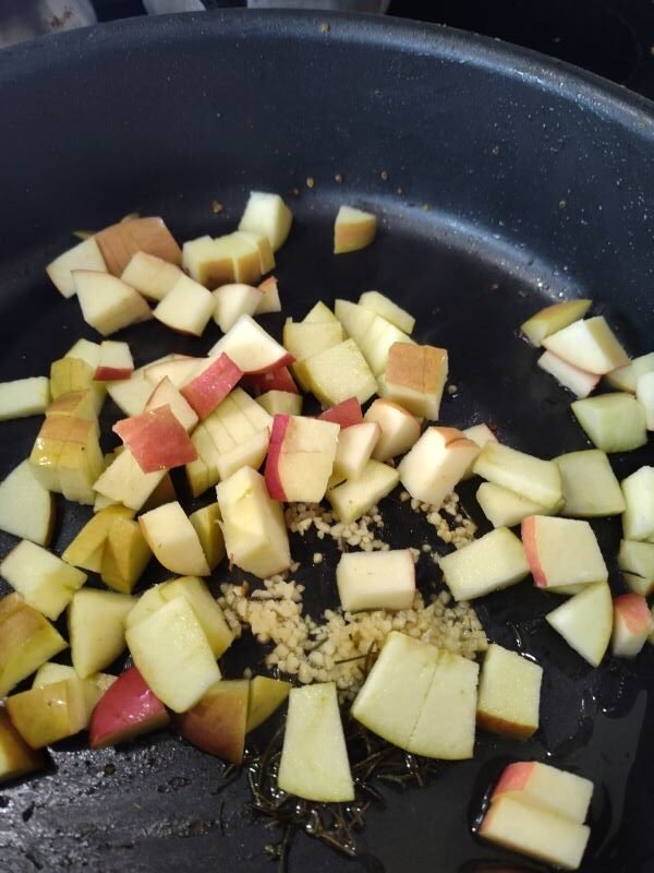 Add the apples and then the cooked sausages and then set aside from burner with lid on to keep moist