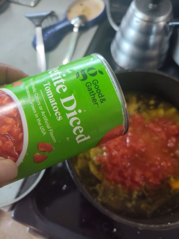 Finally add your diced tomatoes and then chicken and cook on low temperature.