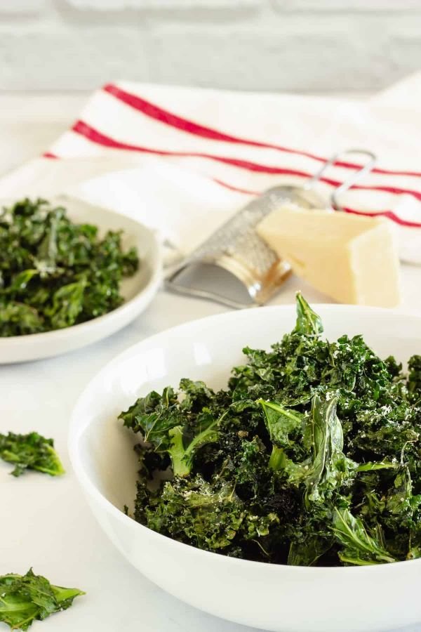 These delicious air fryer kale chips come out crispy, light as air, and perfect every time. Simply seasoned with olive oil, salt, garlic, and Parmesan cheese, they’re the tastiest way to eat more of this superfood. 