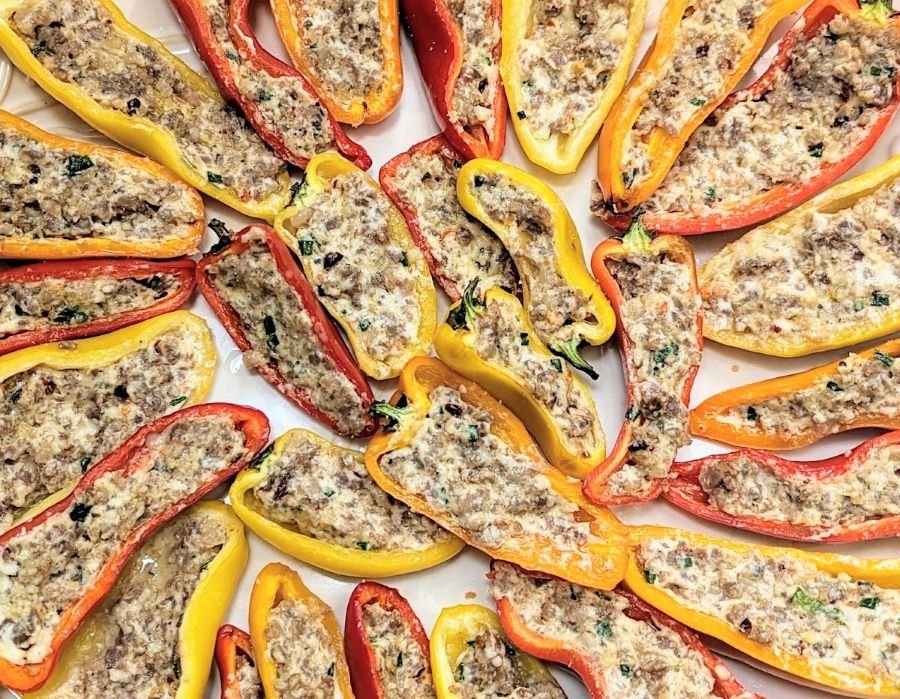 Sausage Stuffed Sweet Mini Peppers are the perfect appetizer to put out at your next party.  Loaded with cream cheese, sausage, garlic, and chives, these bite-size peppers have something for everyone!