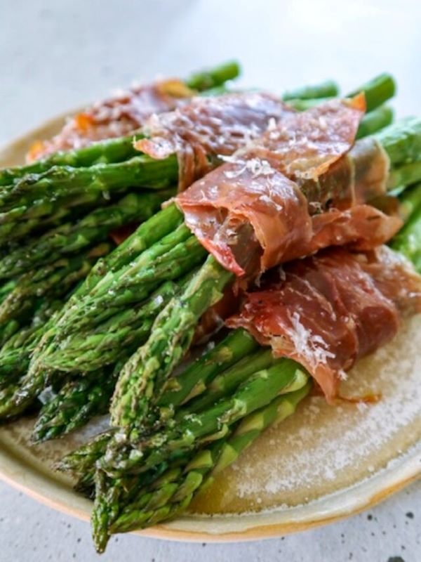 Why you'll love this recipe Quick and Easy: This is an easy recipe, it is ready in under 30 minutes and requires minimal prep work! Impressive Presentation: A beautiful and elegant dish using high-quality ingredients that looks as good as it tastes. Place the asparagus bundles on a pretty serving platter for a beautiful presentation. Versatile: Perfect as an appetizer, or side dish. You can also adjust the recipe to be dairy-free.